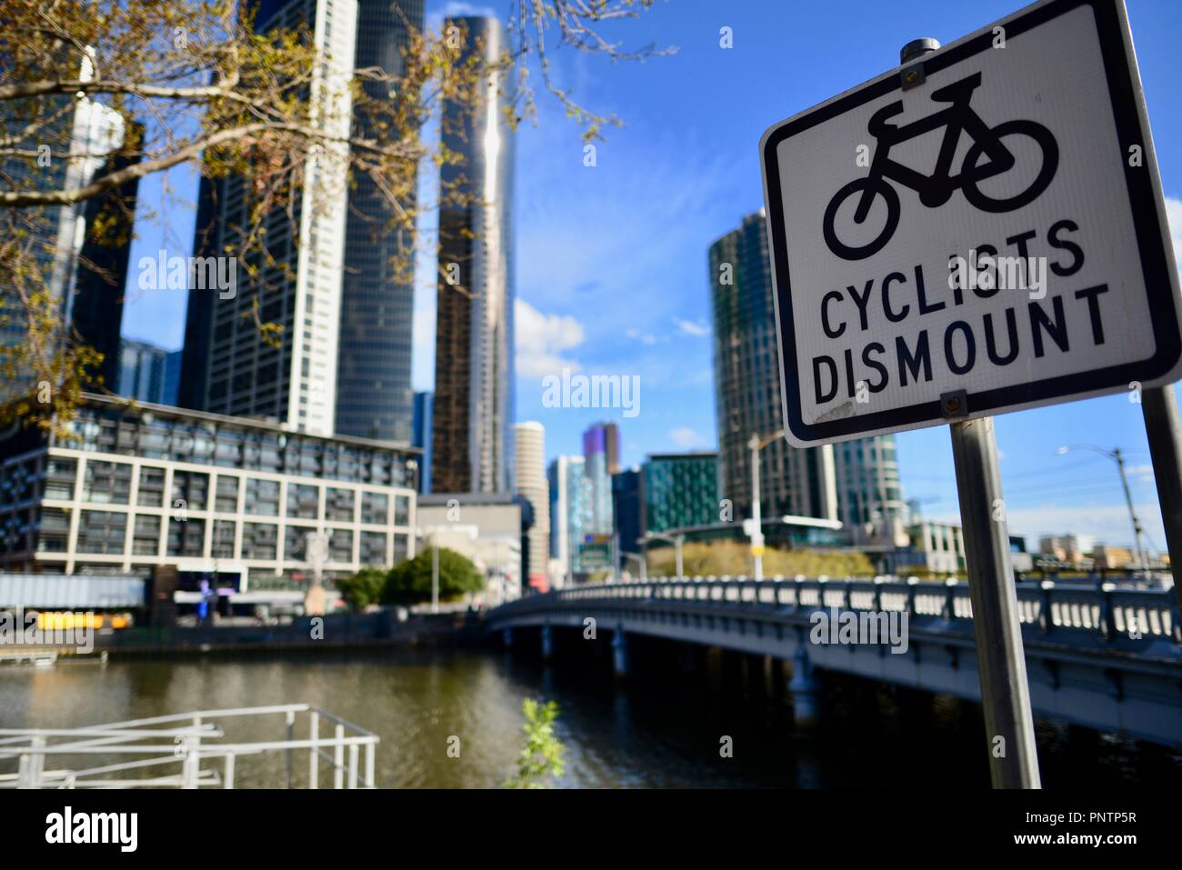 Cyclists dismount sign, Melbourne VIC, Australia Stock Photo