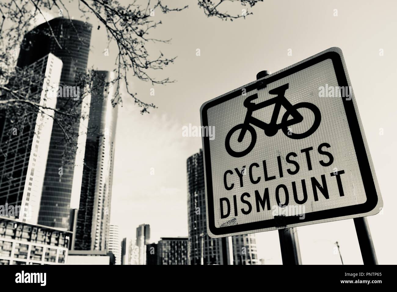 Cyclists dismount sign, Melbourne VIC, Australia Stock Photo