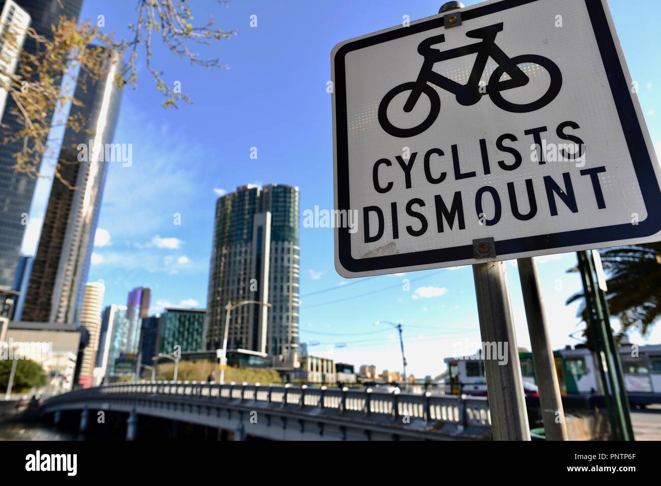 Cyclists dismount sign, Melbourne VIC, Australia Stock Photo
