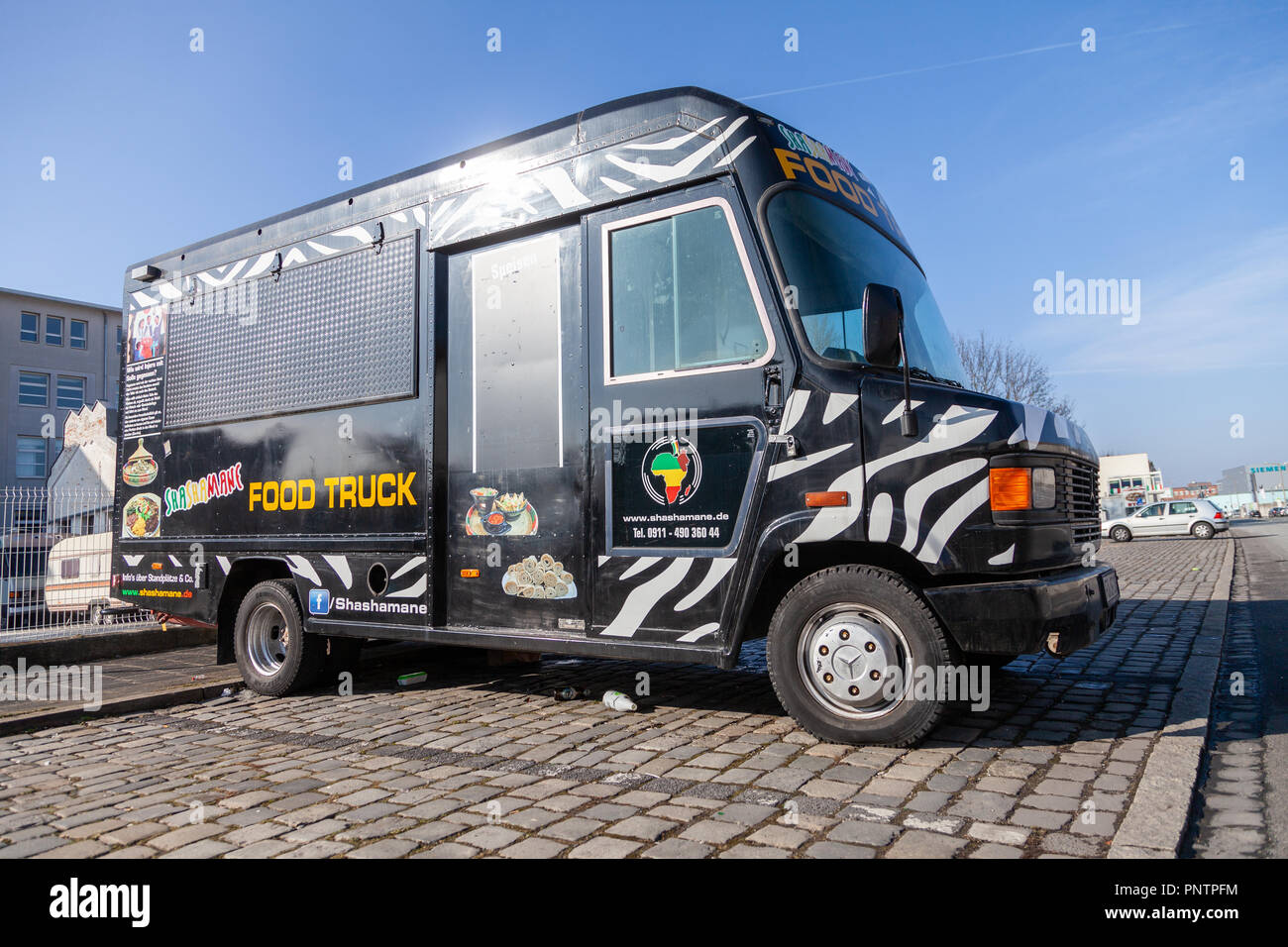 NUREMBERG / GERMANY - MARCH 4, 2018: Closed Shashamane food truck stands on a street. Shashamane sells ethiopian food. Stock Photo