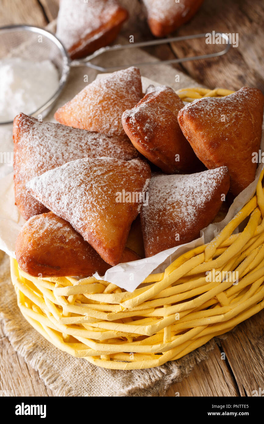 East African Mandazi Dabo Donuts With Powdered Sugar Close Up In The Basket On The Table Vertical Stock Photo Alamy