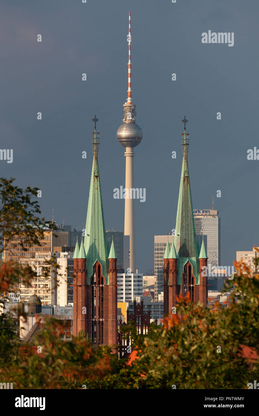 View from Viktoriapark through the spires of Saint Bonifatius Church onto Berlin TV Tower, Germany Stock Photo