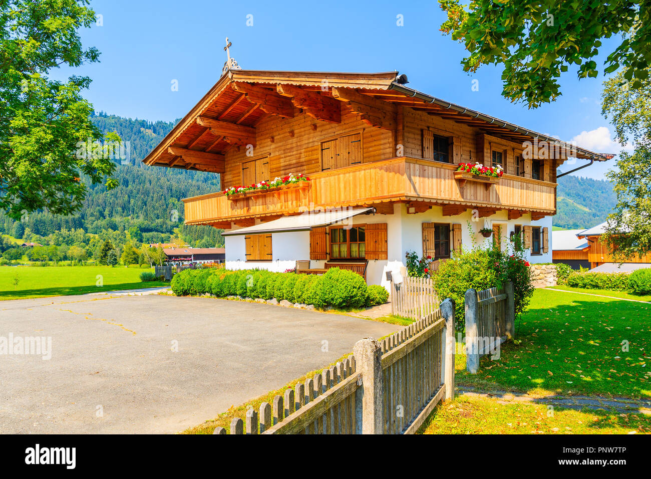 Traditional wooden house decorated with flowers in Reith bei Kitzbuhel
