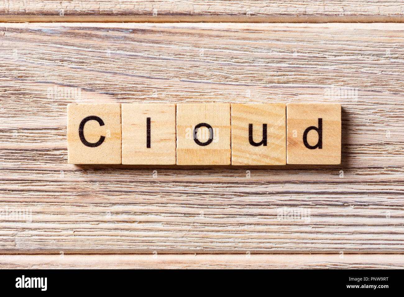 cloud word written on wood block. cloud text on table, concept. Stock Photo
