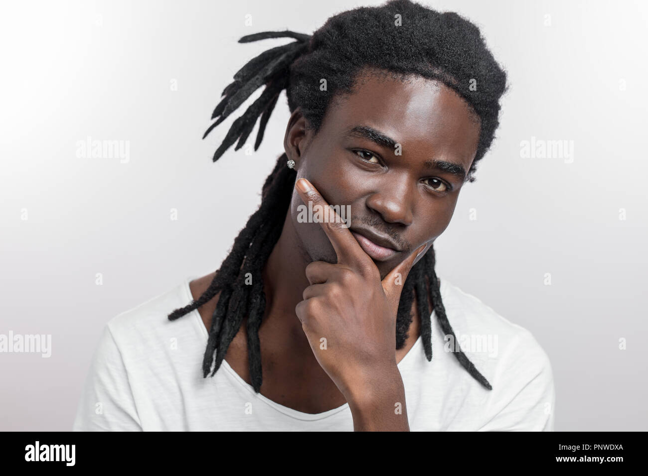 Serious Dark Skinned Male Has Pensive Expression Isolated White