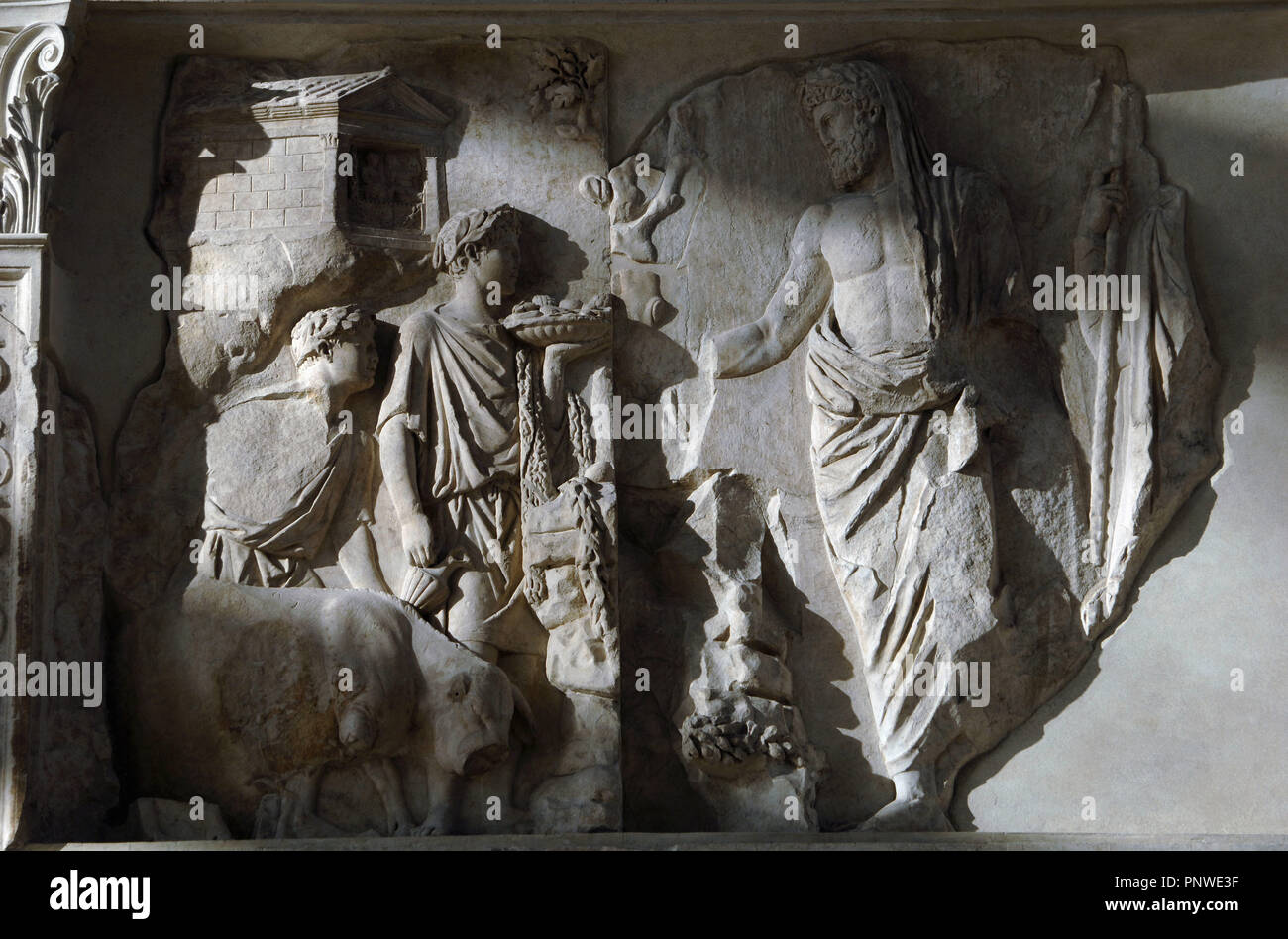 Roman Art. Italy. Pacis Augustae. Aeneas sacrificing to the Penates. Two young attendants in short with laurel wreaths. The taller one holds a fluted tray in his left hand,
