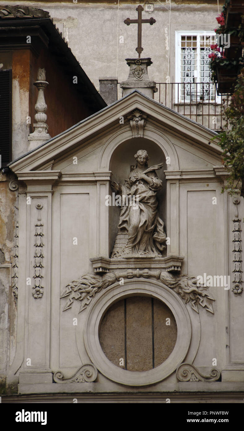 Italy. Rome. Church of Saint Barbara of Librai. Detail of the facade, built by Giuseppe Passeri (1654-1714) with the statue of Saint Barbara by Ambrogio Parisi (1676-1719). 17th century. Stock Photo