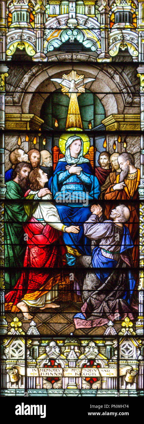 Stained-glass window in The Cathedral of the Madeleine depicting the Mother of God in the midst of apostles on Pentecost Stock Photo