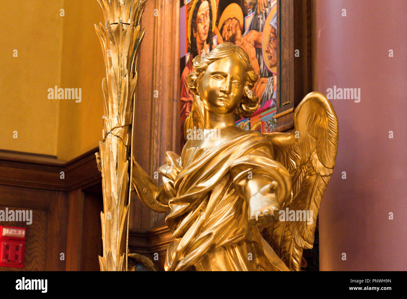 A golden statue of an angel in the Cathedral of the Madeleine (Mary Magdalene), Salt Lake City, Utah, USA. Stock Photo