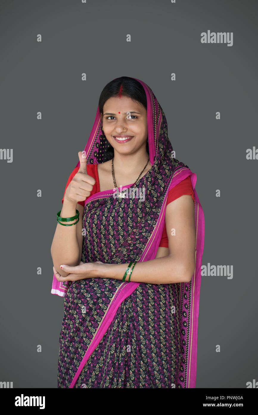 happy pregnant woman in saree showing thumbs up Stock Photo - Alamy