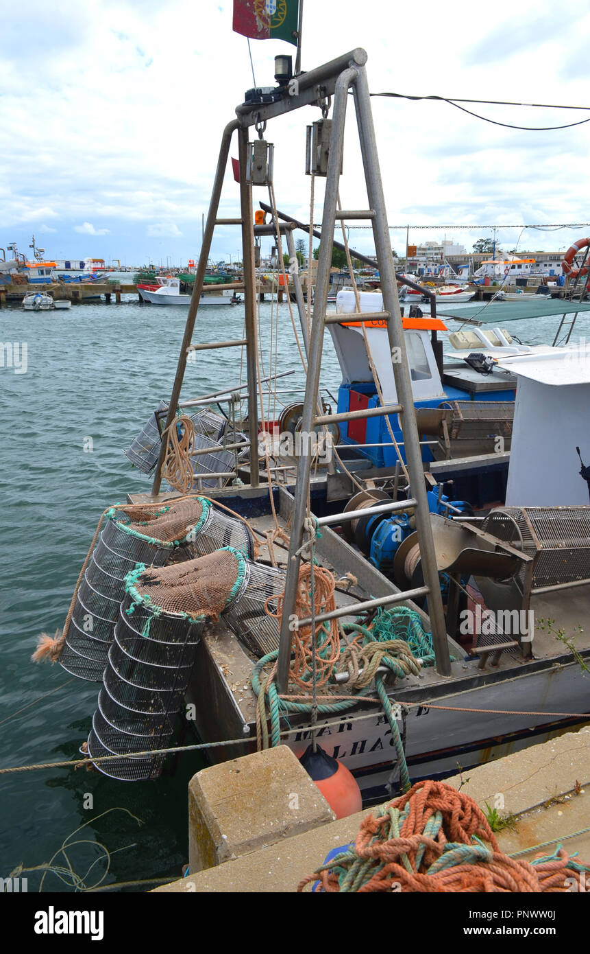 Small-scales fisheries: Ganchorra boats in the Olhão harbour (Algarve,  Southern Portugal). The ganchorra (grid dredge) is an artisanal fishing  gear us Stock Photo - Alamy