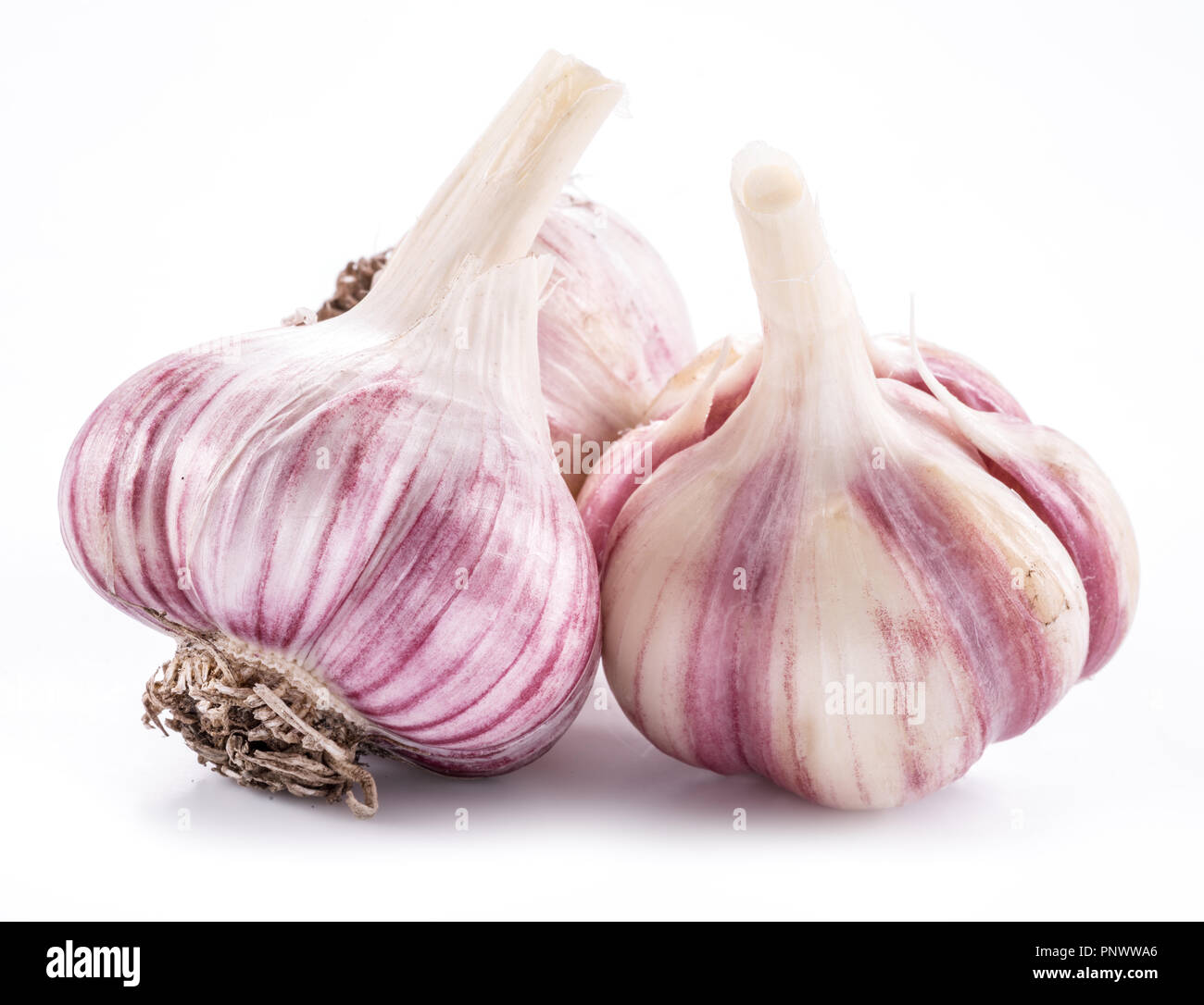 Three garlic bulbs isolated on white background. Stock Photo