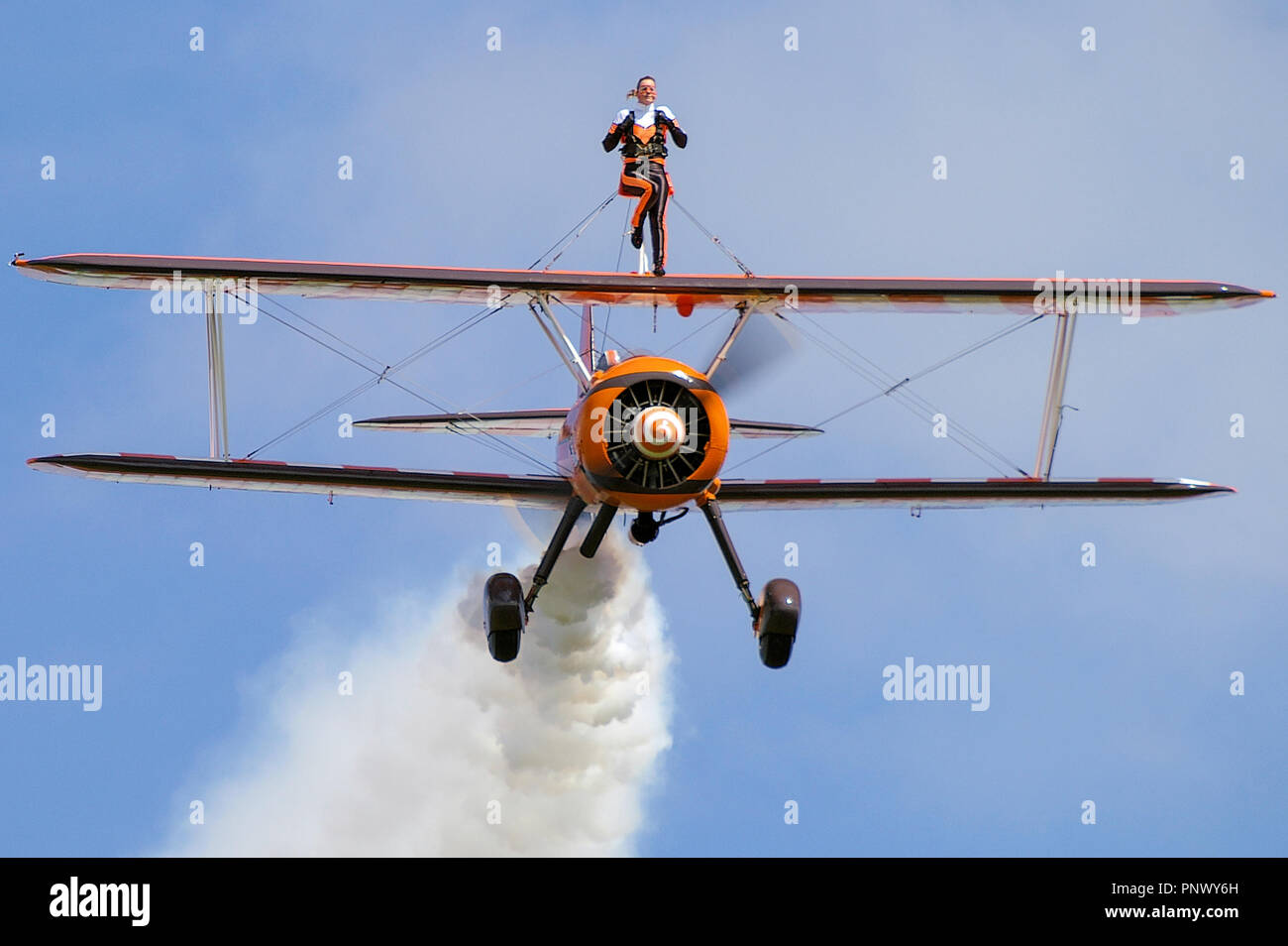 Aerosuperbatics Breitling Wingwalkers Boeing Stearman plane. Female