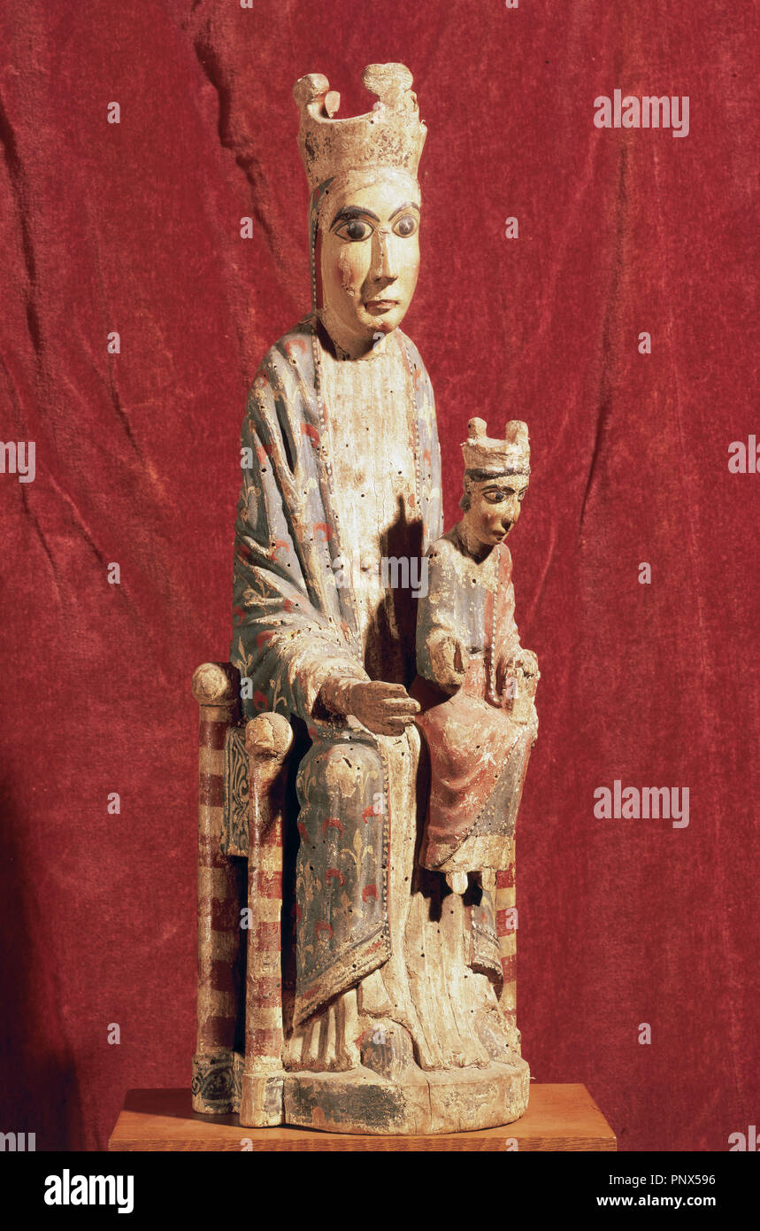 Romanesque. Virgin with Holy Child. Polychrome carving from the 12th century. Uncertain origin, from Catalonia. National Art Museum of Catalonia, Barcelona, Catalona, Spain. Stock Photo