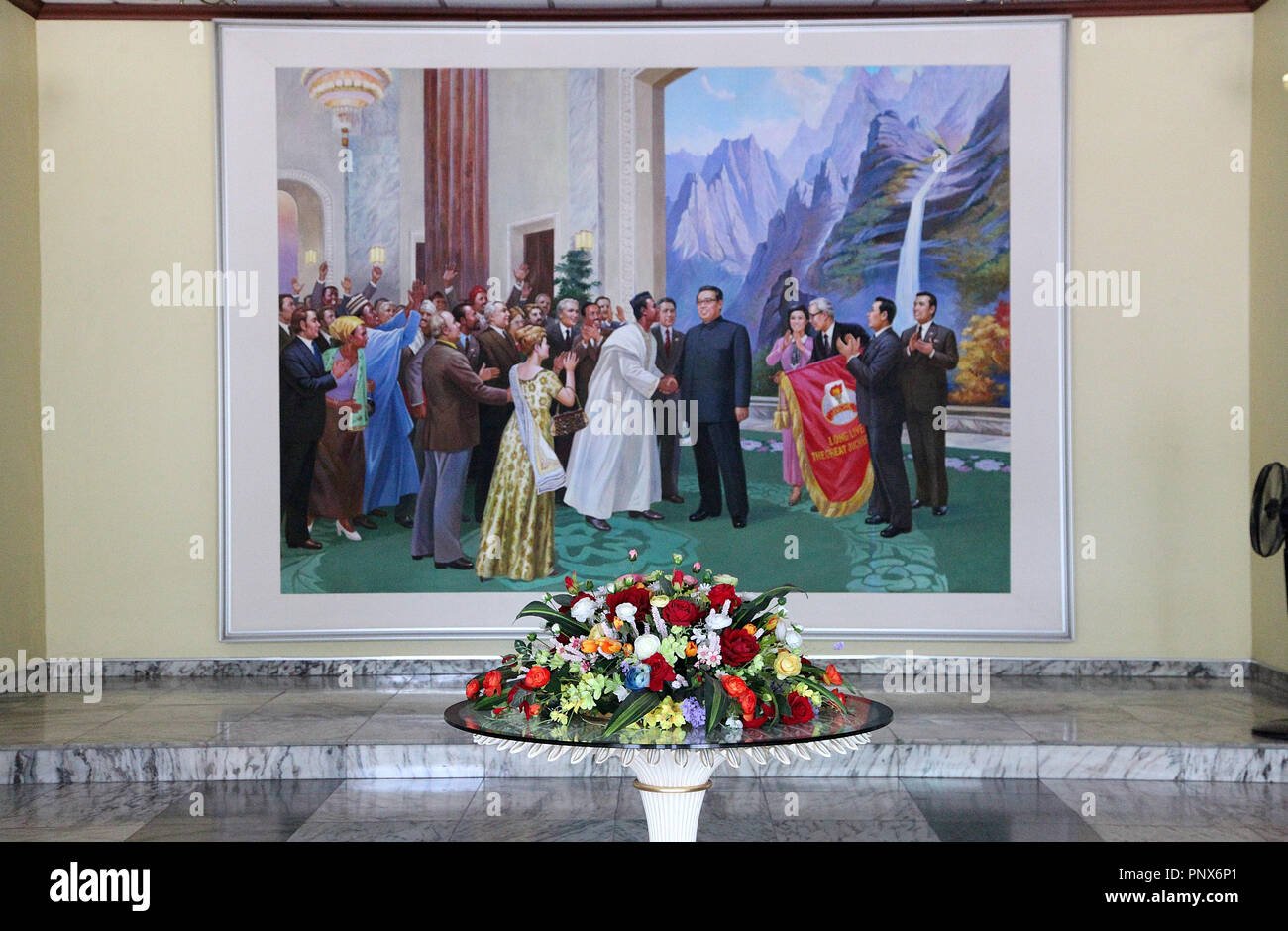 Painting in North Korea of Kim Il Sung meeting other world leaders Stock Photo