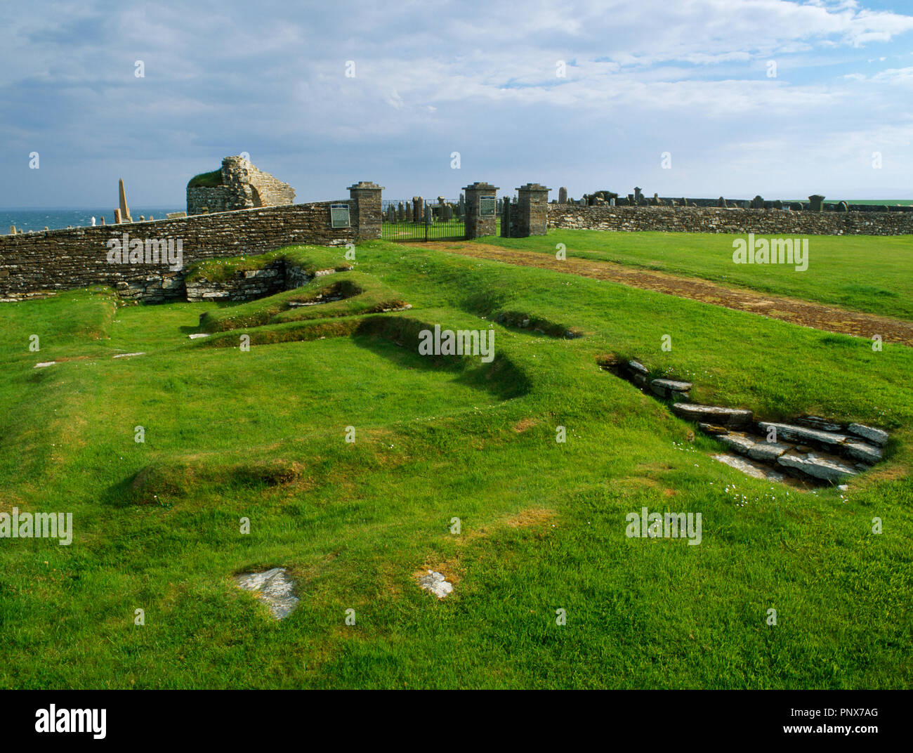 Earl's Bu & Church: view SSW of the foundations of a Viking-age building at Orphir, Orkney, Scotland, UK, with the C12th round church to the rear. Stock Photo