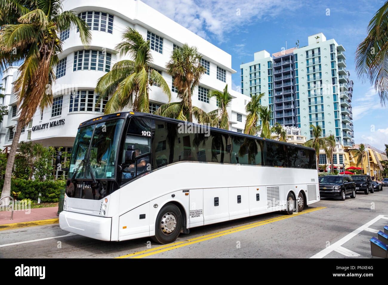 Miami Beach Florida,Collins Avenue,motorcoach,bus,visitors travel traveling tour tourist tourism landmark landmarks culture cultural,vacation group pe Stock Photo
