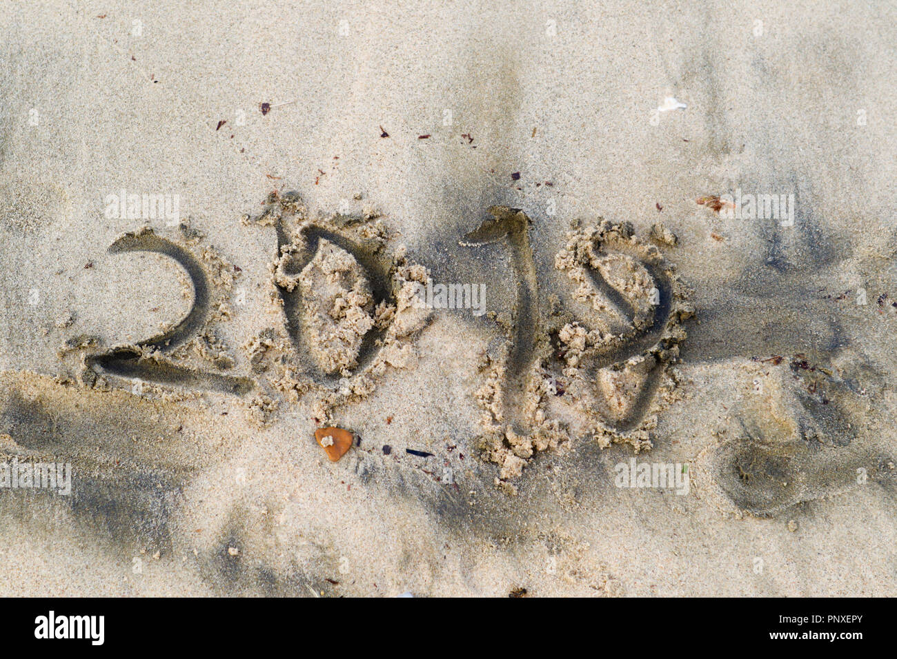 ugly and clumsy letters 2018 on sandy beach, concept of the outgoing ...
