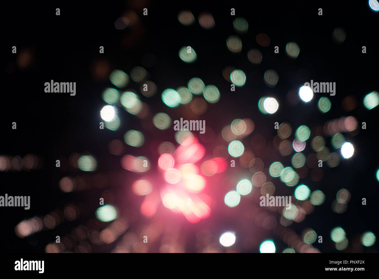 exploding fireworks in night sky. Stock Photo