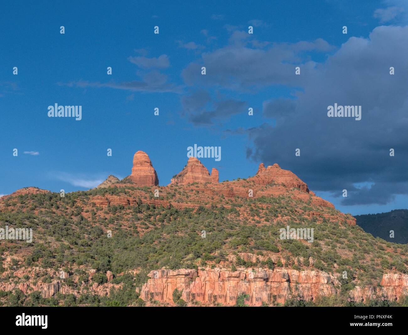 Beautiful red rock mountains in Sedona, Arizona against a dark blue sky