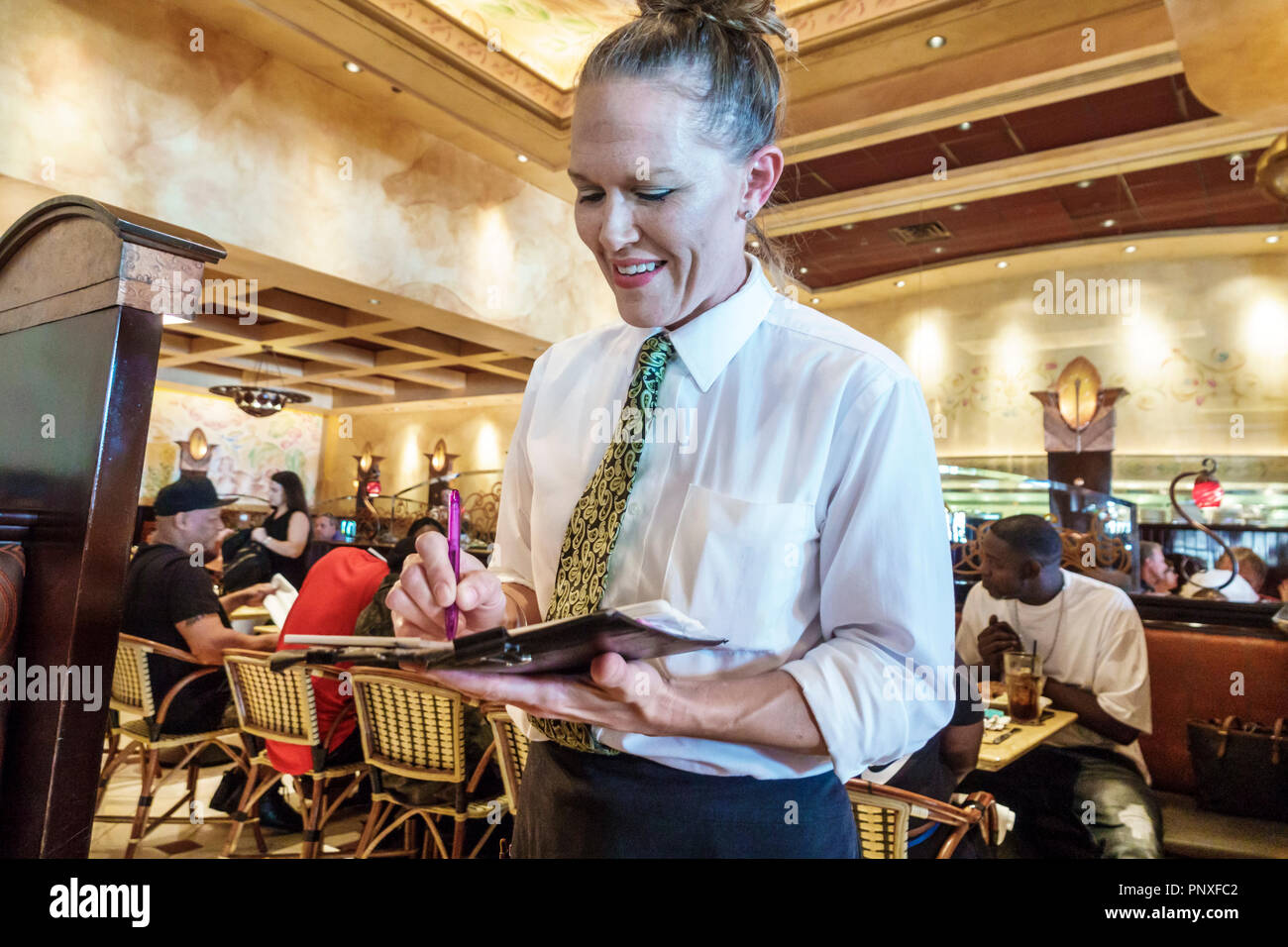 West Palm Beach Florida,City Place CityPlace,Cheesecake Factory,restaurant restaurants food dining cafe cafes,interior inside,woman female women,waite Stock Photo