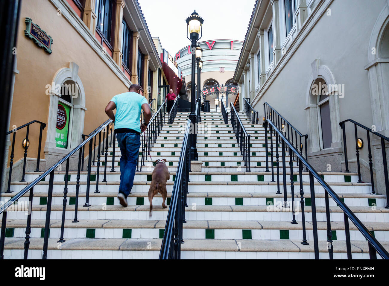 West Palm Beach Florida,The Square formerly CityPlace,theater theatre,steps,man men male,dog,climbing,FL180212061 Stock Photo