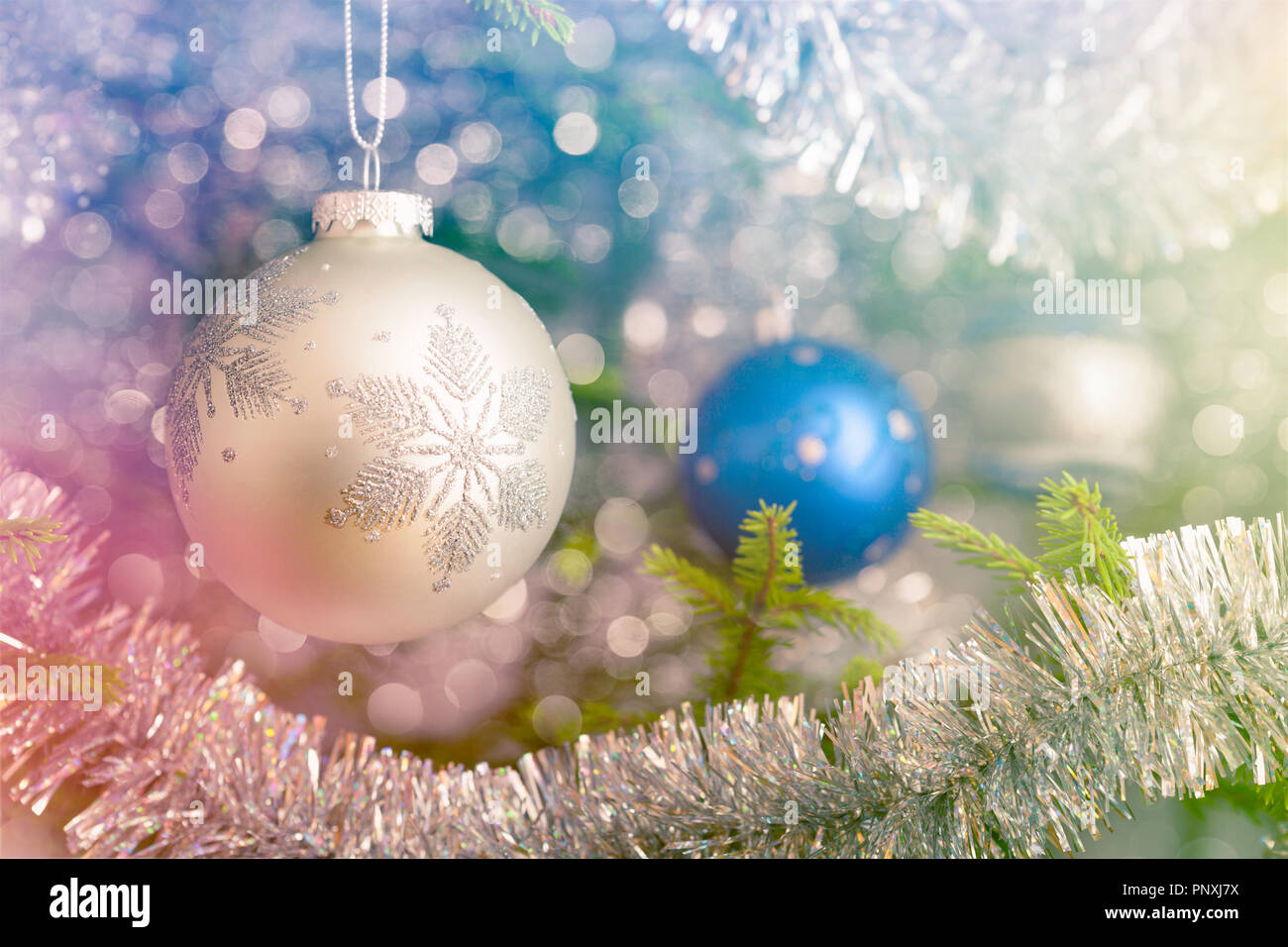 Christmas-tree decoration bauble on decorated Christmas tree bac Stock Photo