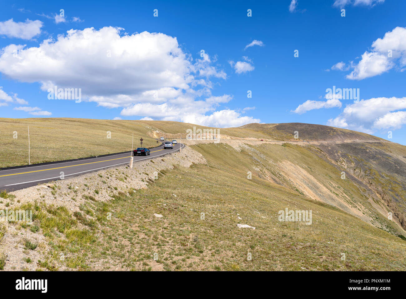 Mountain Road - Summer view of busy Trail Ridge Road at top of Rocky Mountain National Park, Colorado, USA. Stock Photo