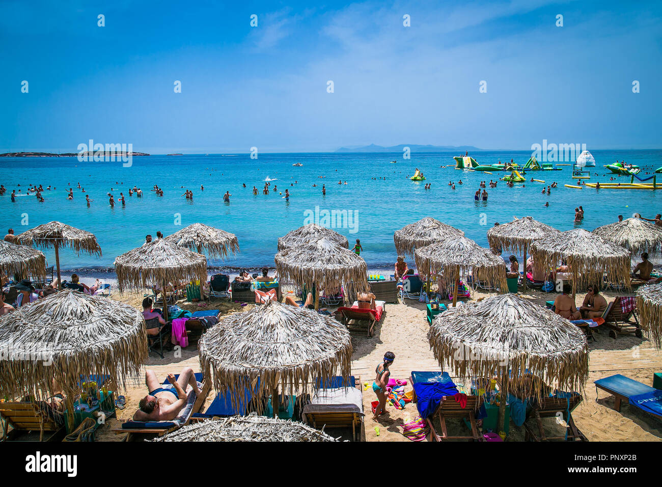 ATHENS, GREECE - JUNE 19, 2016: People on the Voula beach in Athens, Greece . Stock Photo