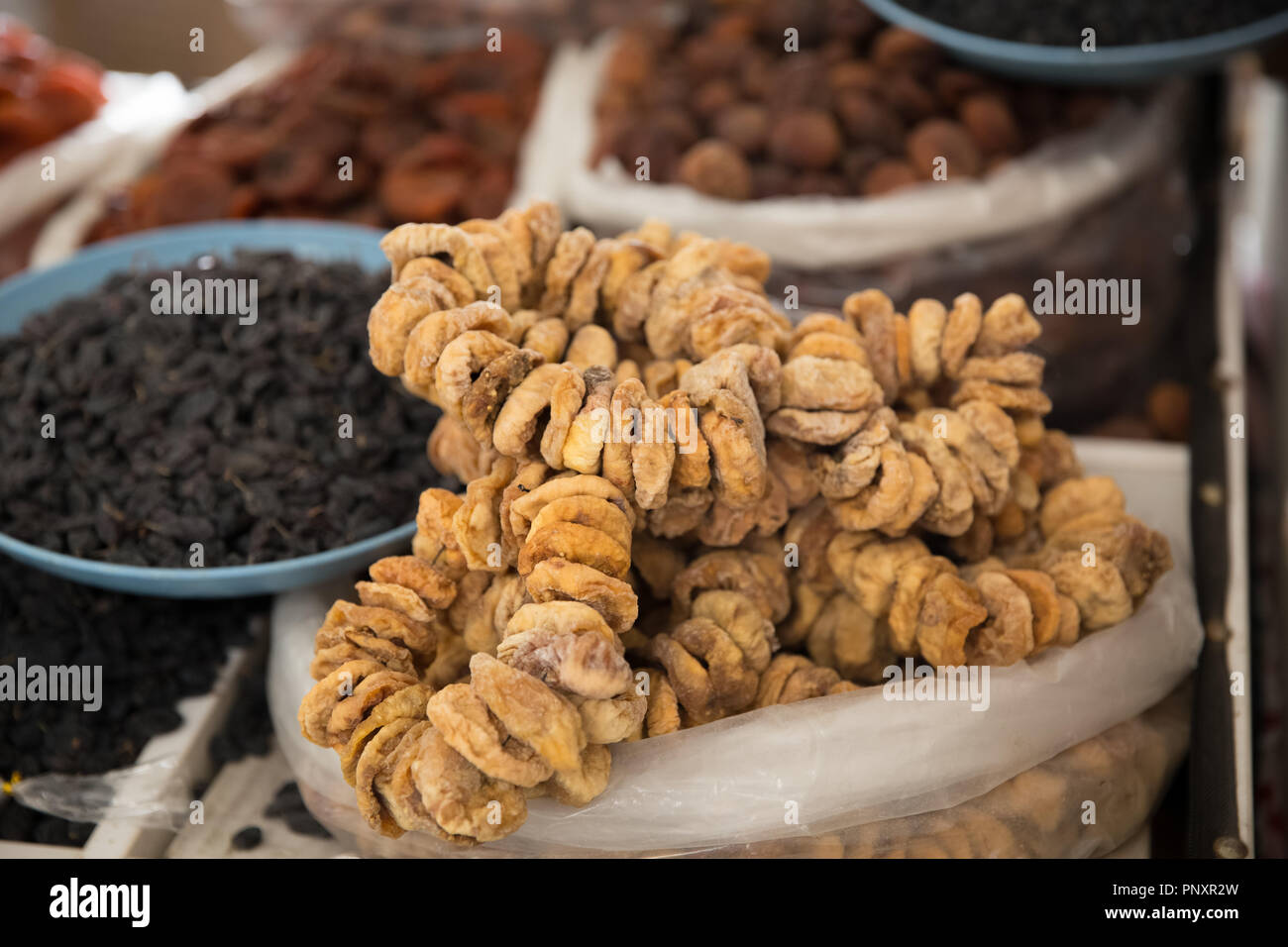 Various dry fruits like dates, figs, pista, dried grapes, almonds and