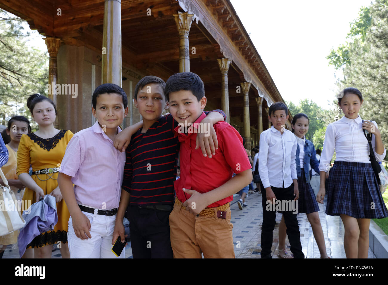 Tashkent, Uzbekistan - May 12, 2017: Playful children posing to camera during their visit to Independence square. Stock Photo