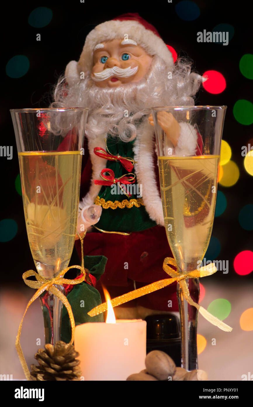 Christmas decorations and two glasses of champagne with a background ...