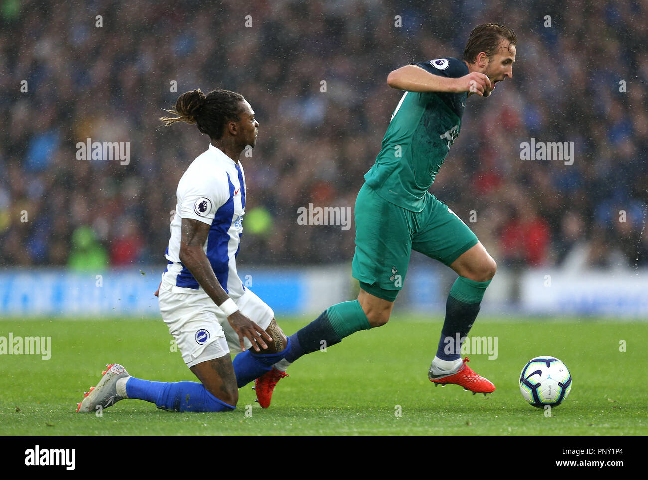 Brighton & Hove Albion's Gaetan Bong (left) and Tottenham Hotspur's Harry Kane (right) battle for the ball during the Premier League match at the AMEX Stadium, Brighton. PRESS ASSOCIATION Photo. Picture date: Saturday September 22, 2018. See PA story SOCCER Brighton. Photo credit should read: Steven Paston/PA Wire. RESTRICTIONS: No use with unauthorised audio, video, data, fixture lists, club/league logos or 'live' services. Online in-match use limited to 120 images, no video emulation. No use in betting, games or single club/league/player publications. Stock Photo