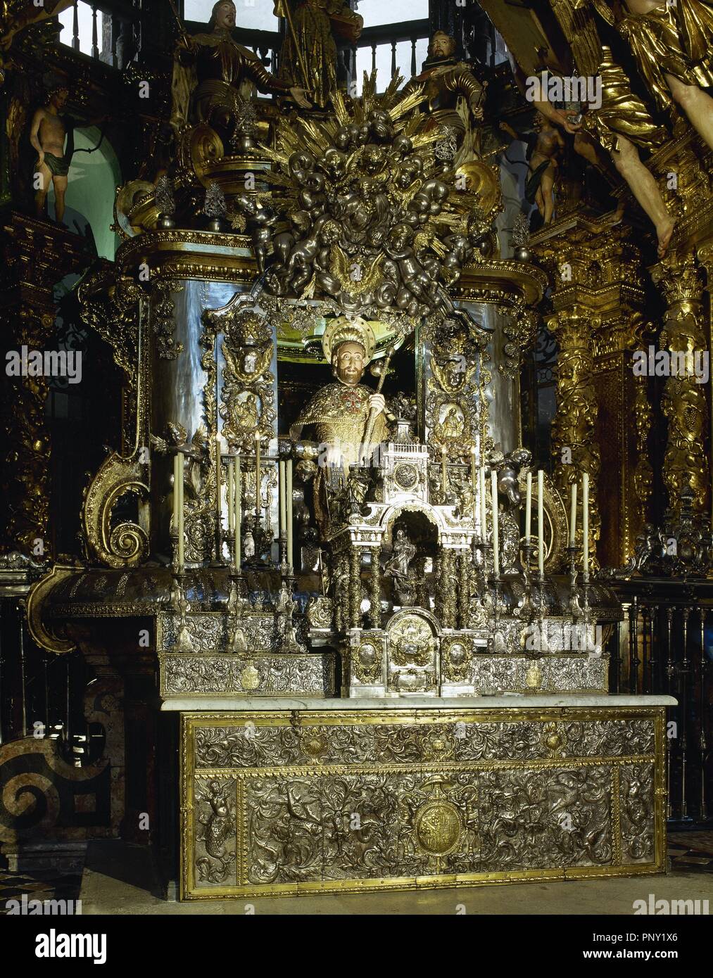 Main altar of the Cathedral of Santiago de Compostela. A bejeweled medieval stone statue of St. James (12th century). Remodeled, sitting on a silver chair and covered by a silver enclosure. Santiago de Compostela Cathedral. Santiago de Compostela, Province of La Coru–a, Galicia, Spain. Stock Photo