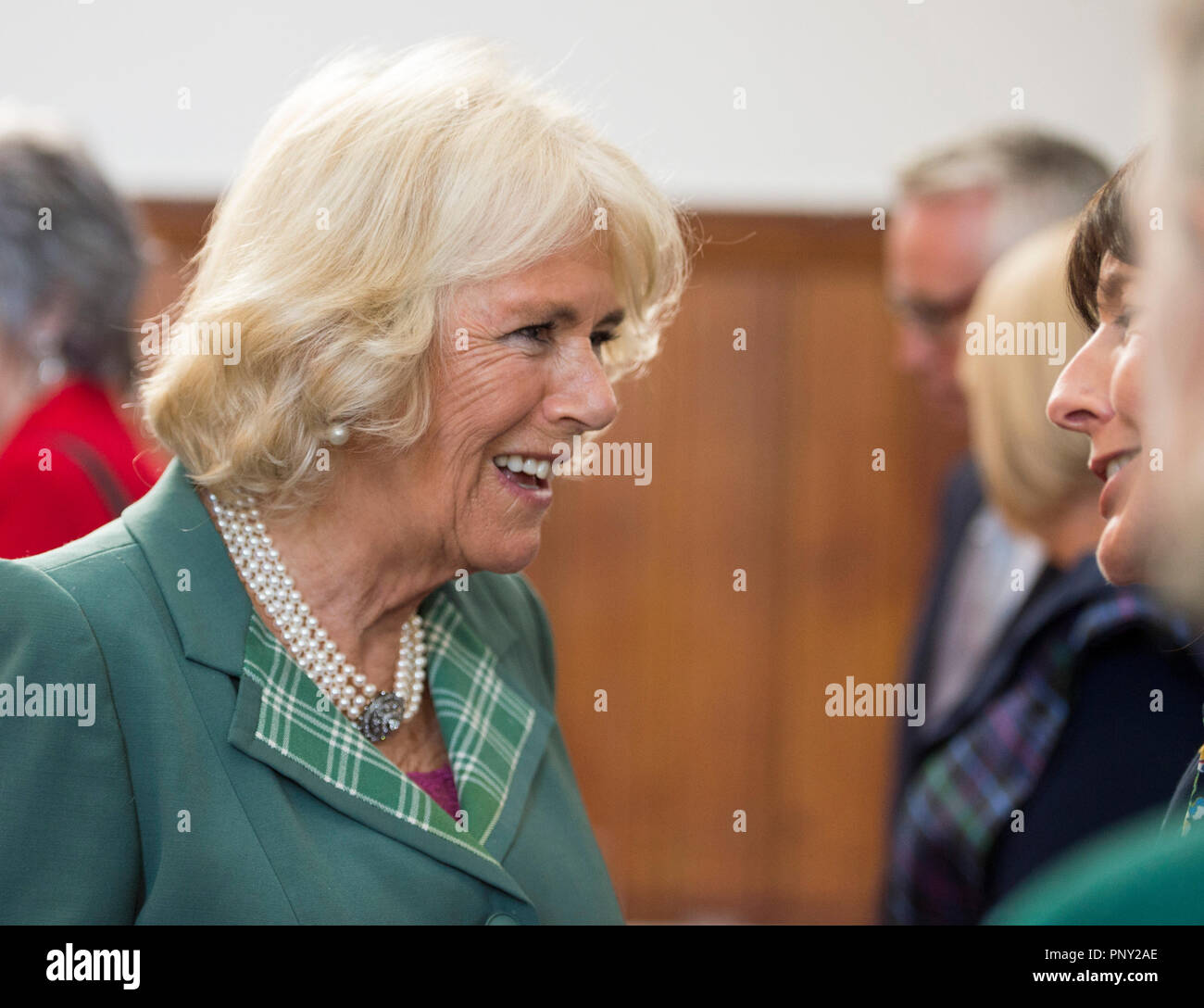 The Duchess of Cornwall, known as the Duchess of Rothesay in Scotland, meets guest as she attends the premiere of Requiem: The Souls of the Righteous, performed by the National Youth Choir of Scotland and the Royal Scottish National Orchestra, at Walpole Hall, St Mary's Cathedral in Edinburgh. Stock Photo