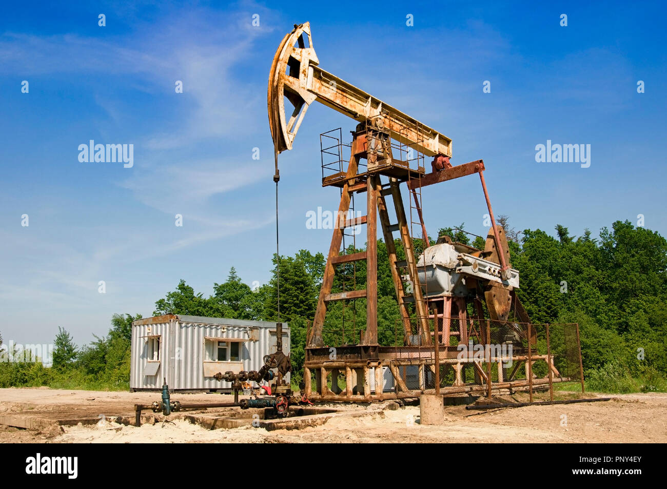 oil pump is on a background mountains Stock Photo