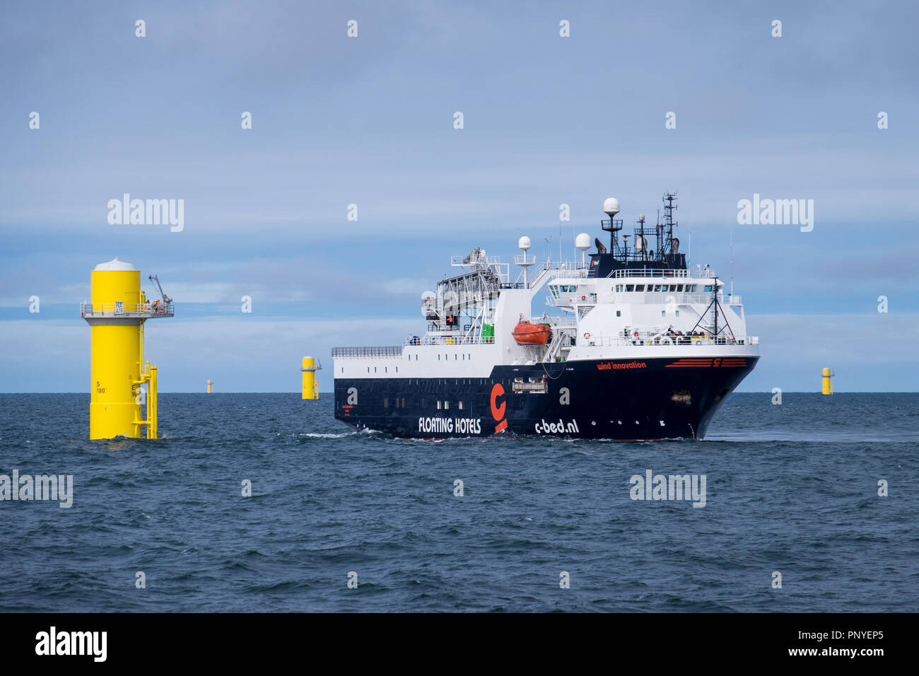 The floating hotel ship, Wind Innovation, working on Hornsea Project One Offshore Wind Farm. Stock Photo