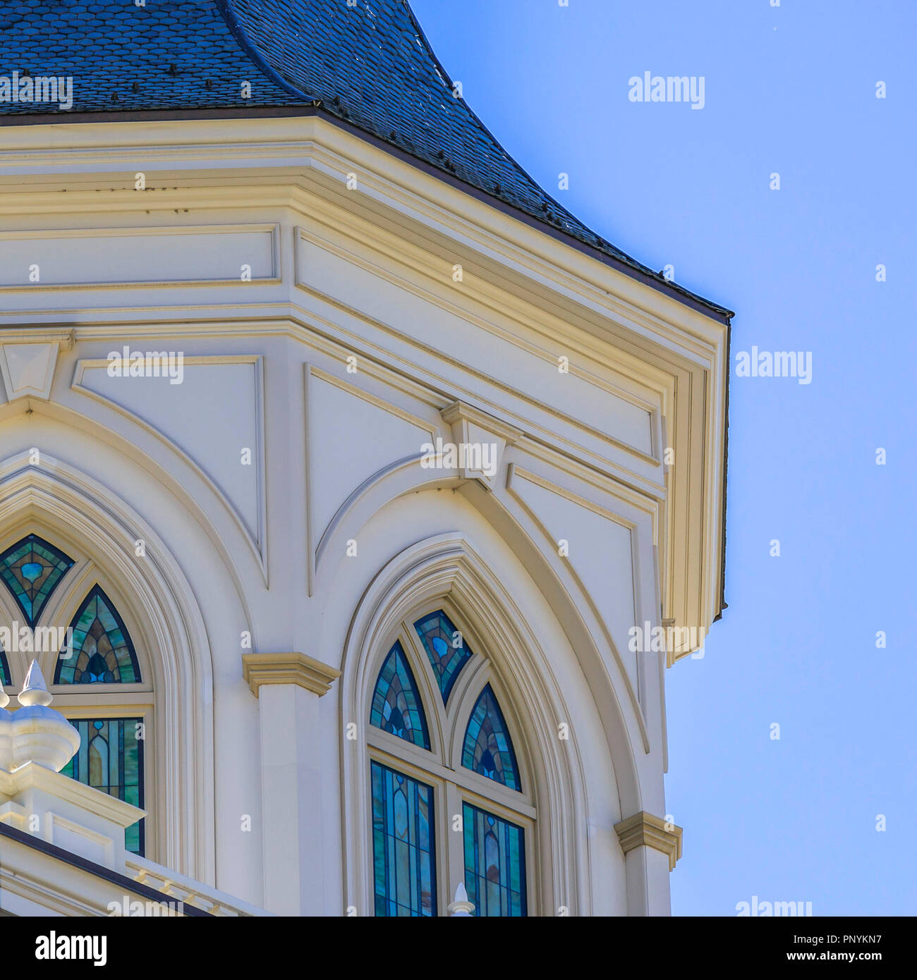 Building with stained glass on arched windows Stock Photo Alamy