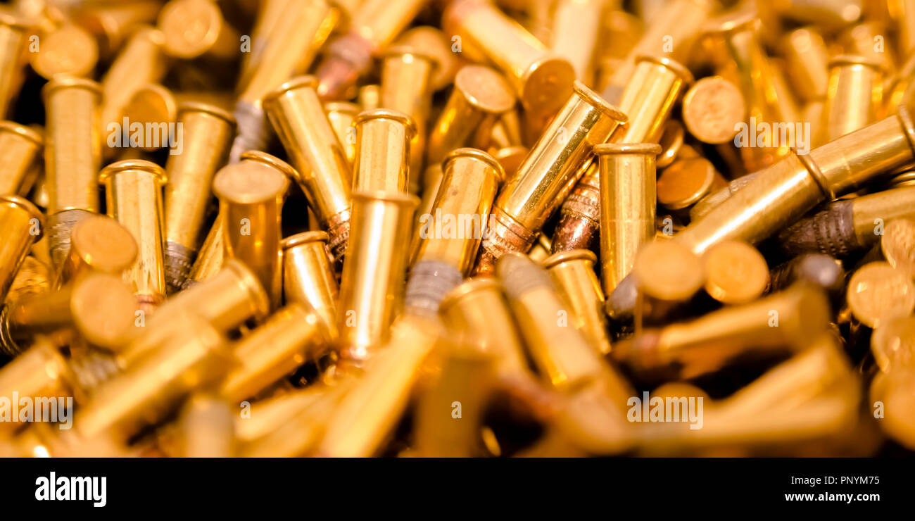 Cylindrical golden bullets in a pile Stock Photo Alamy