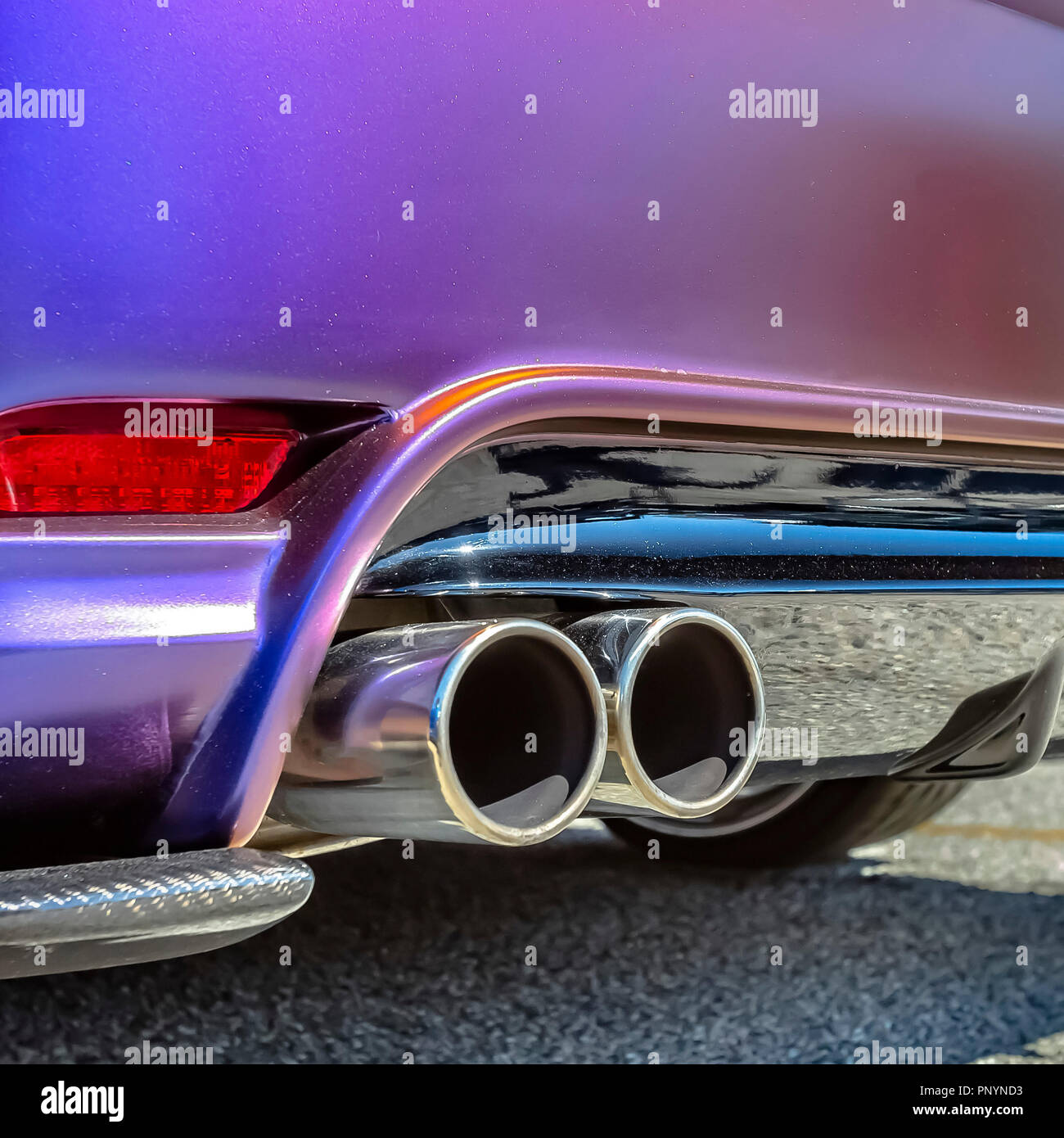 Purple car with dual exhaust pipe Stock Photo Alamy