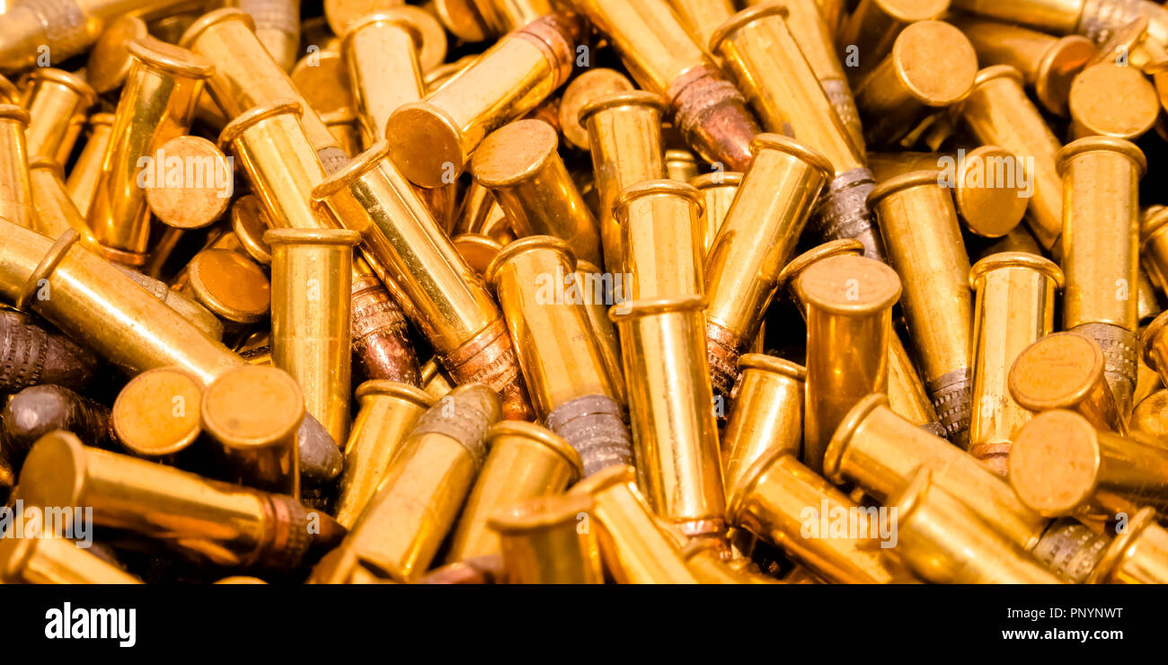Shiny gold plated ammunition with silver head Stock Photo - Alamy