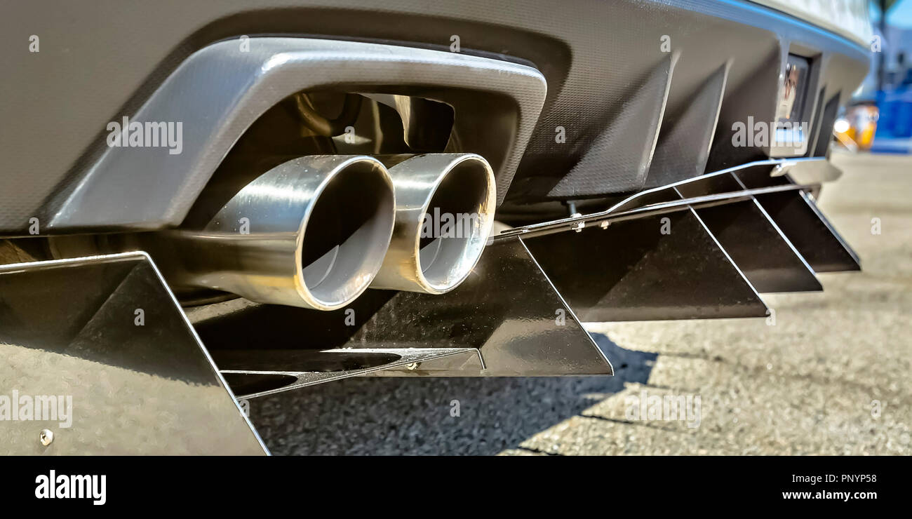 Twin exhaust pipe of a car with rear spikes Stock Photo Alamy