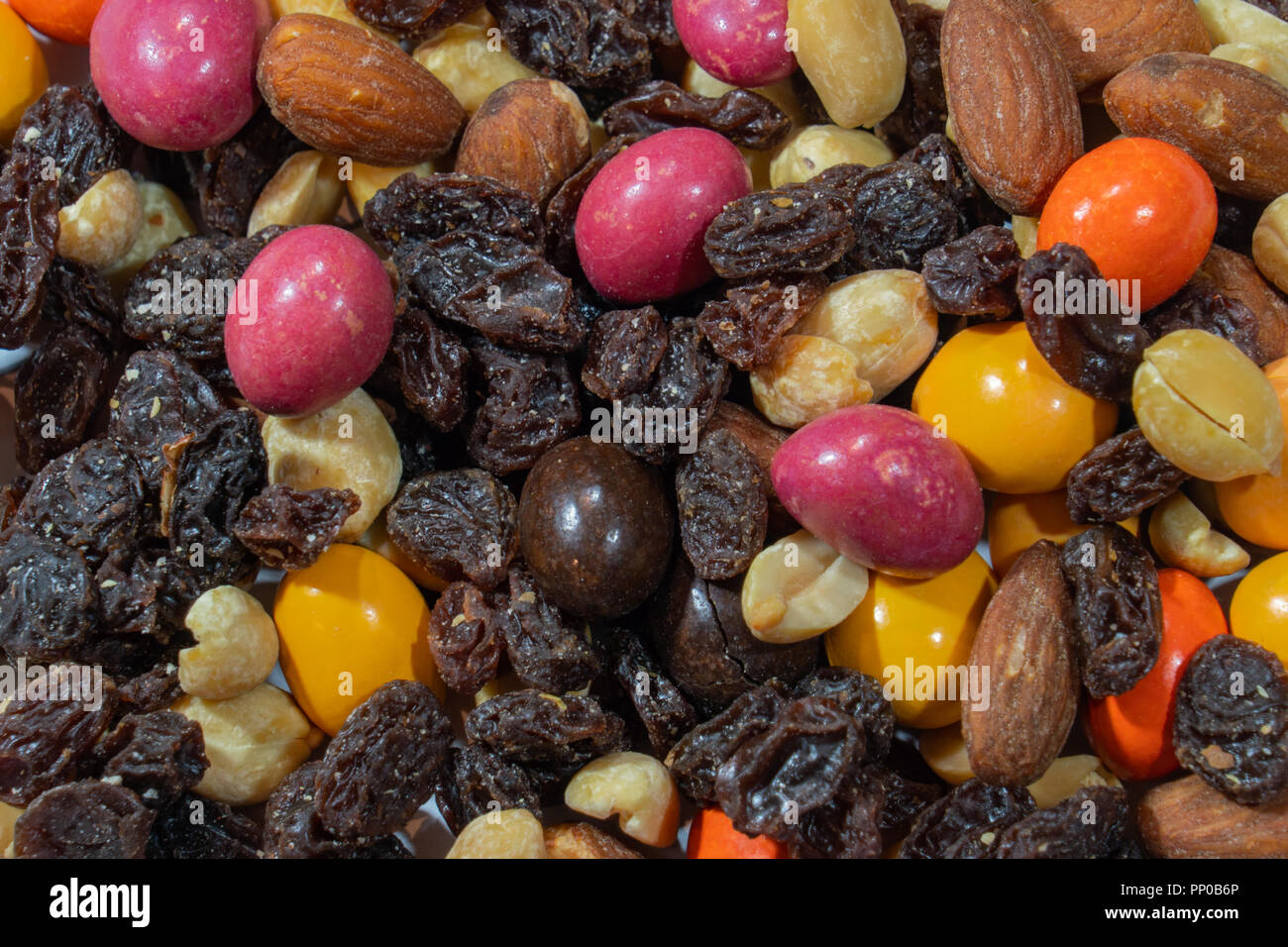 Trail mix close up macro raisins, almonds, nuts, peanuts, and