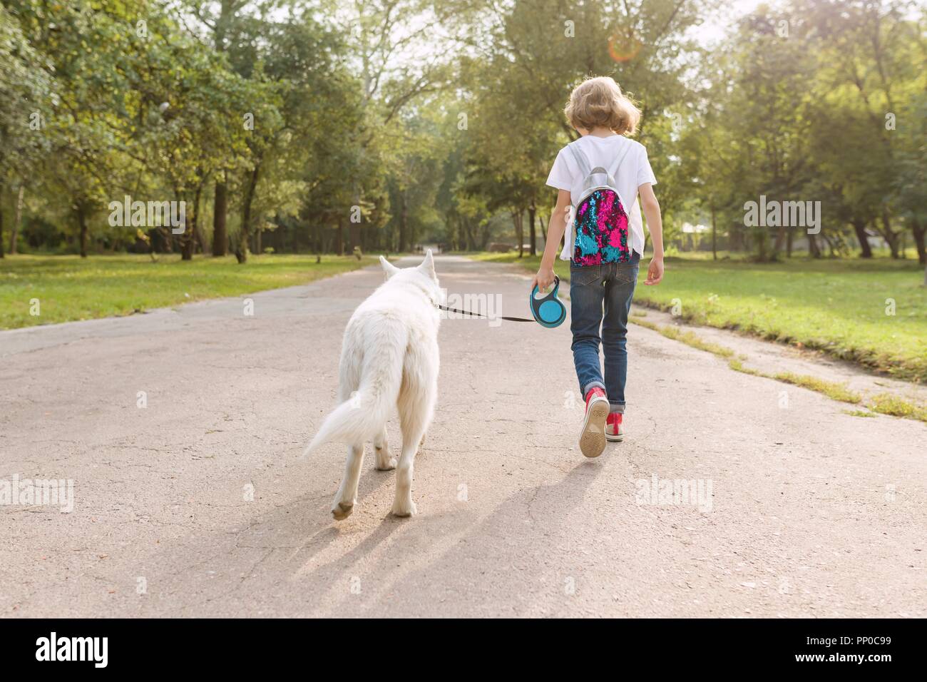 kids walking dog