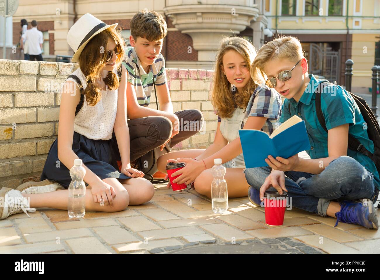 Happy 4 Teenage Friends Or High School Students Reading Books Happy 4 teenage friends or high school students reading books