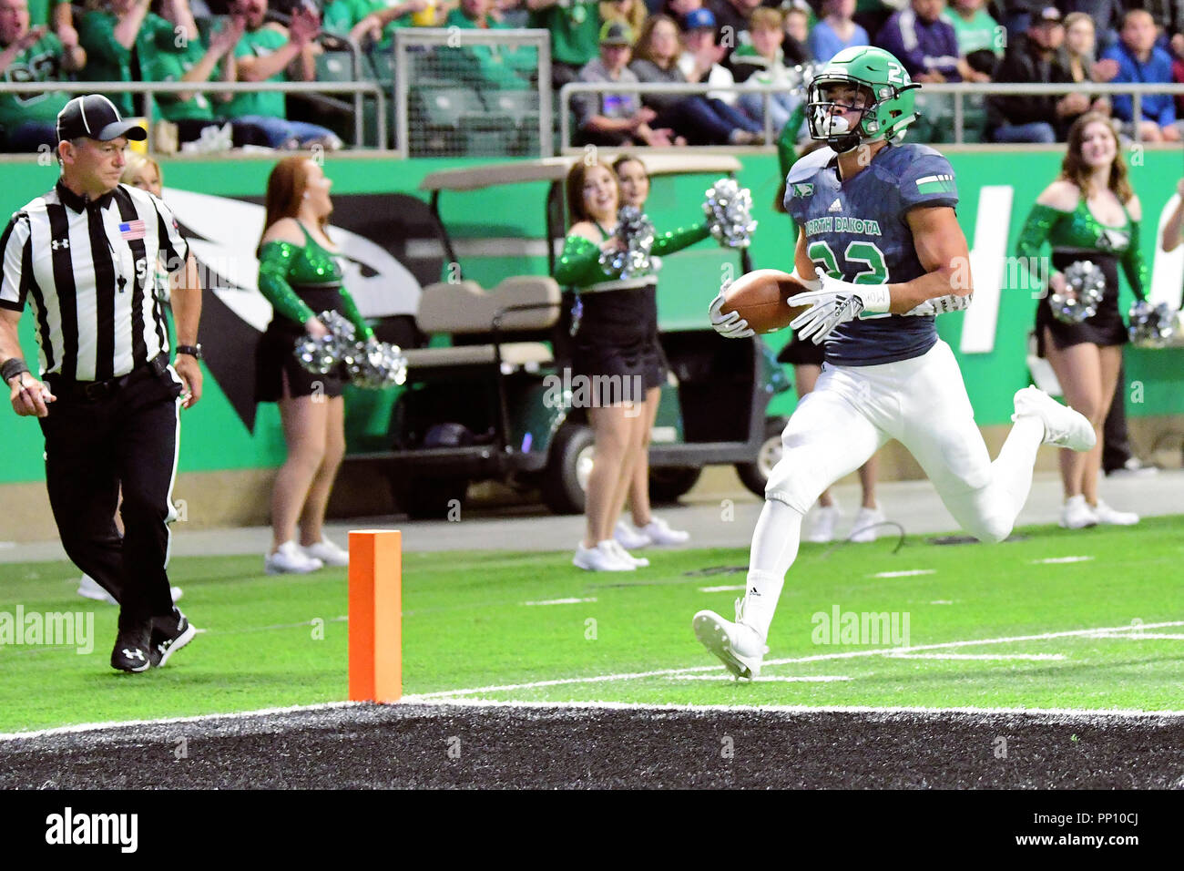 Grand Forks, North Dakota, USA. 22nd Sep, 2018. North Dakota Fighting Hawks running back John Santiago (22) scores a touchdown during a NCAA football game between Idaho State and the University of North Dakota at the Alerus Center in Grand Forks, North Dakota. Idaho State won 25 to 21. Russell Hons/CSM/Alamy Live News Credit: Cal Sport Media/Alamy Live News Stock Photo