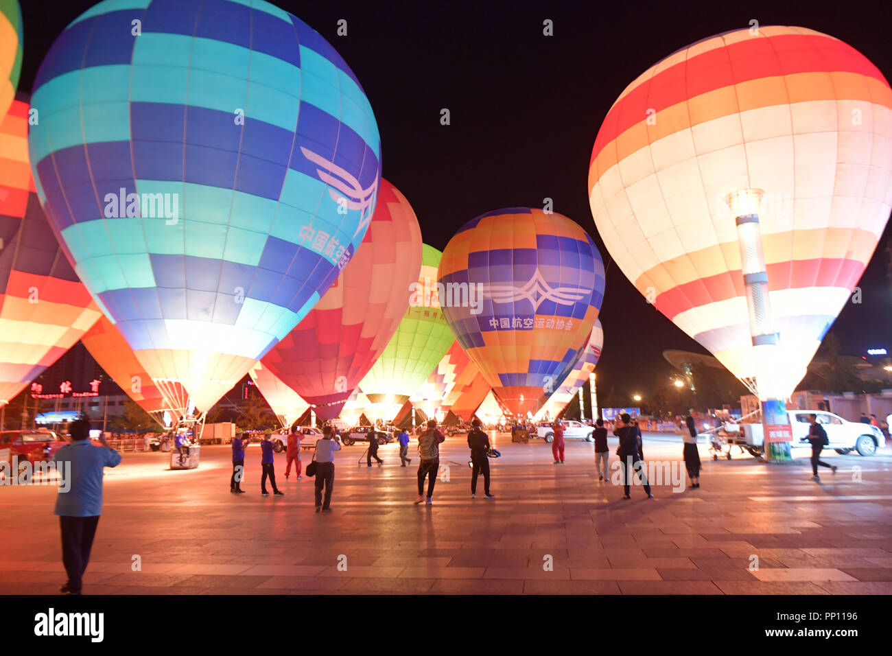 Xiangyang, China's Hubei Province. 22nd Sep, 2018. Hot air balloons are seen during a balloon festival at the Zhuge Liang Square in Xiangyang City, central China's Hubei Province, Sept. 22, 2018. A total of 33 delegations attended the festival, organized by the Chinese Balloon Club League. Credit: An Fubin/Xinhua/Alamy Live News Stock Photo