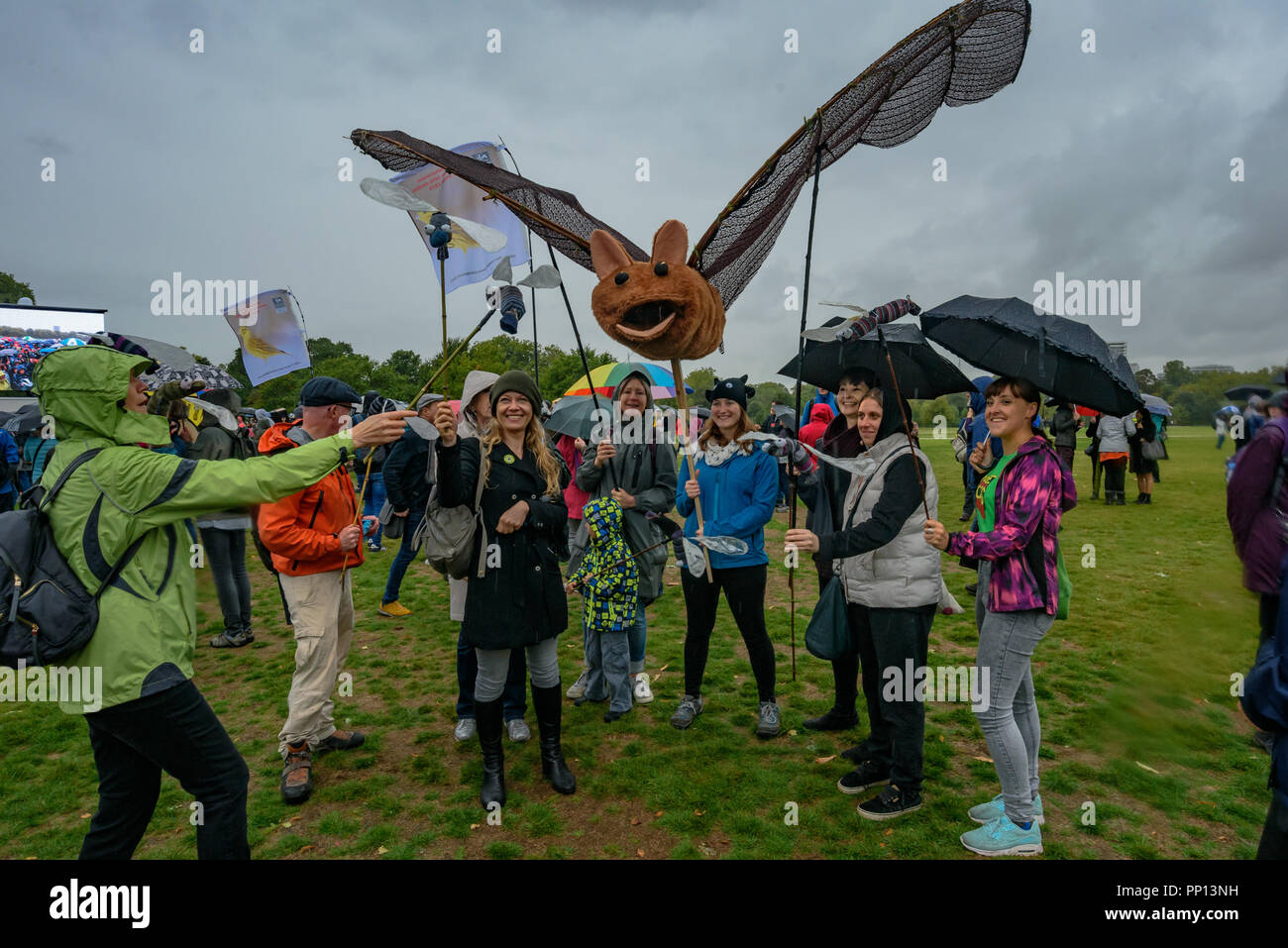 London, UK. 22 September 2018. Green Party members including Sian Berry and Caroline Lucas MP pose with the campaigners holding a giant bat and midges at the rally. Several thousands came to a rally in Hyde Park before the march through London on The Peoples Walk for Wildlife set up by naturalist and broadcaster Chris Packham to support the People's Manifesto for Wildlife drawn up by him with the aid of 17 independent experts and scientists aimed at halting the drastic decline in British wildlife. The even was supported by many NGOs, schools and environmental activists. Credit: ZUMA Press, Inc Stock Photo