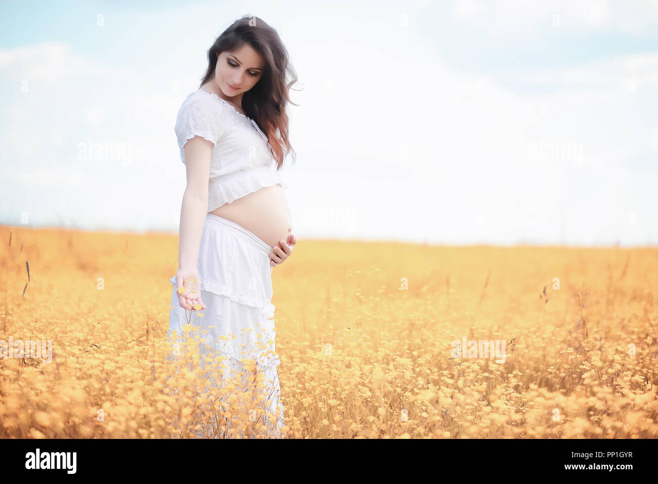 Pregnant woman in nature for a walk in the autumn Stock Photo - Alamy