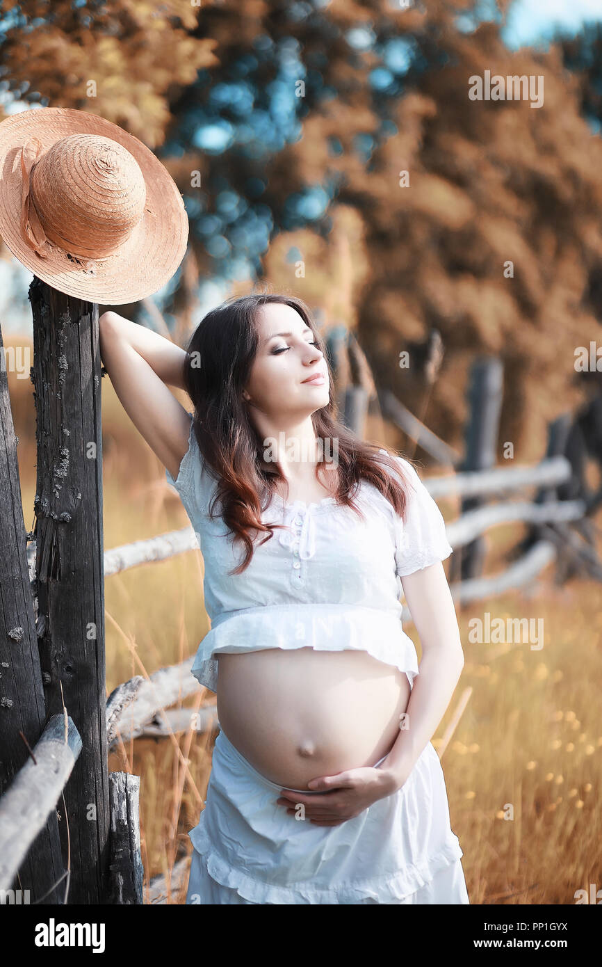Pregnant woman in nature for a walk in the autumn Stock Photo - Alamy